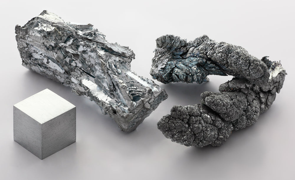 Metallic zinc fragment and one cubic centimetre cube